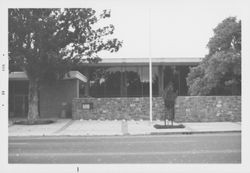 Library's basalt wall before and after erection of the Library sign