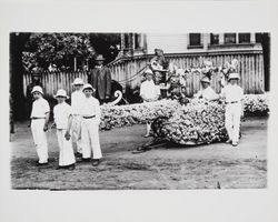 Boys towing a small float