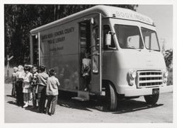 Children waiting in line to use the Bookmobile