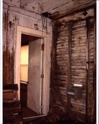 Interior door and unfinished wall inside livery stable that stood at the corner of D and First Streets, Petaluma, California, Sept. 25, 2001