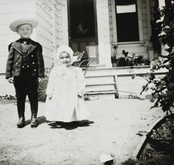 Charles Raymond standing with his cousin Edith Raymond at the Raymond home, 522 D Street, Petaluma, California, about 1902