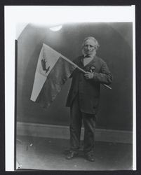 Bear Flag Party member Peter Storm, holding a version of the Bear Flag that he designed, about 1870