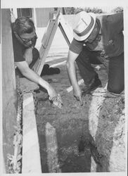 Ed Mannion and Ed Fratini examining traces of the Petaluma and Haystack Railroad, Petaluma, California, about 1960