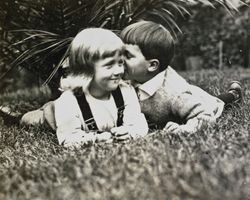 Wilfred Everett Bixby, Jr. and an unidentified girl at the Bixby house, 415 Perkins Street, Oakland, California, about 1913