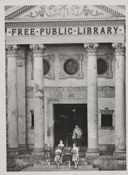 Front view of Petaluma Carnegie Library with children and adult, 20 Fourth Street, Petaluma, California, November 28, 1956