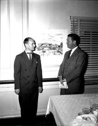 Two men in front of a drawing of the Petaluma Adobe, Petaluma, California, about 1958