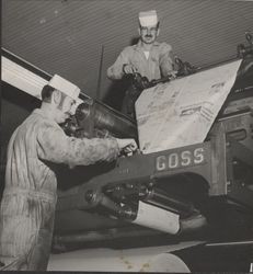 Workers servicing the printing press at the Petaluma Argus-Courier, Petaluma, California, about 1955