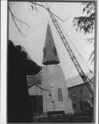 Raising the steeple of Church of One Tree at its Juliliard Park (Santa Rosa, California) location