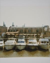 Boats moored along the dock under the Petaluma and Santa Rosa Railroad trestle, Petaluma, California, about 1990