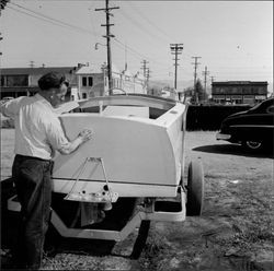 Man polishing a boat