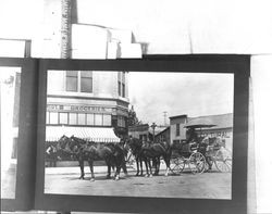 Jack London and his team in front of C. Schmidt Groceries, 1911