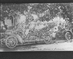 Mrs. Bacon and friends--car decorated for Rose Parade