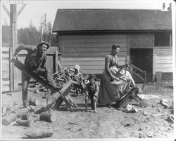 Titus family sawing wood