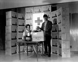 Unidentified Red Cross volunteers preparing boxes for shipment, Santa Rosa, California, September 27, 1967