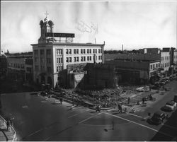 Demolishing the American Trust Company building at the corner of Fourth Street and Exchange Avenue, next door to the Empire Building, Santa Rosa, California, 1949