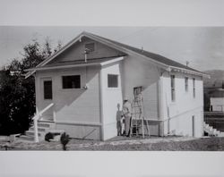 Lewis B. Evans paints the Evans home, Petaluma, California, 1948