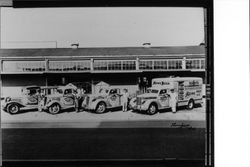 Trombetta Distributing Company trucks at warehouse