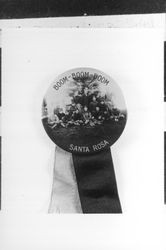 Boom-boom-boom--football team depicted on a lapel badge