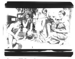 Four women making coffee over a campfire, Petaluma, California, about 1930