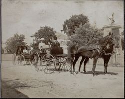 Unidentified passengers in horse drawn carriages, Sixth Street, Petaluma, California, between 1890 and 1900