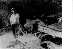 Richard Sonoma Beedle inspecting the remains of his tractor