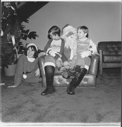 Santa Claus and children at a National Controls Christmas party, Santa Rosa, California, 1979