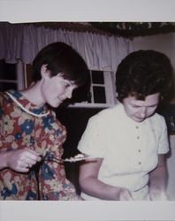 Sally L. Cheney and Barbara Volkerts cut the cake in Sonoma County, California, 1960s