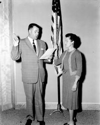 County Clerk Gene Williams swearing in an unidentified woman