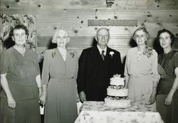 George and Emily Blank pose with Louise Nissen, Gertrude Taft and Florence Bergman and their cake for a photograph during their golden wedding annniversary celebration at the Green Mill Inn on November 1, 1949