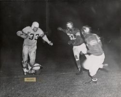 Run play during Petaluma Leghorns game against the Marin Lions