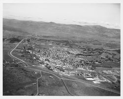 Aerial view northward of US Highway 101 under construction and Healdsburg, California, 1963