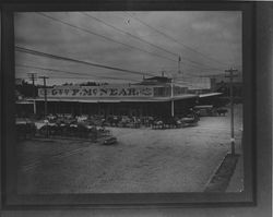 Wagons loaded with bags of feed outside the McNear building, Petaluma, California, 1900