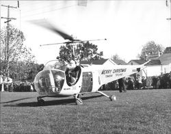 Santa arrives at McNear Park in a helicopter courtesy of Tomasini Hardware, Petaluma 1948