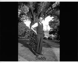 Russell Nissen standing in front of a palm tree at Hill Plaza Park, Petaluma., about 1939