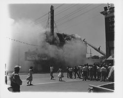 Extinguishing the fire at the California Theatre, Petaluma, California, 1957