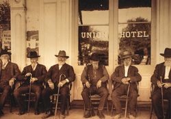 Men sitting in front of Union Hotel