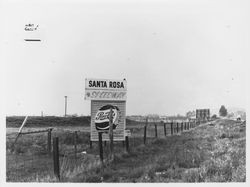 Sign pointing to Santa Rosa Speedway along Mendocino Avenue (Highway 101) near Russell Avenue in Santa Rosa, California, 1959