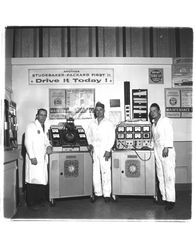 Three men with automotive diagnostic equipment, Petaluma, California, about 1957