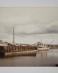 Sand barge and steamer moored on the Petaluma River, Petaluma, California, October 1981