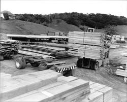 Foklift stacking lumber on a trailer at Idaco Lumber yard, Healdsburg, California, 1963