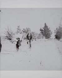 Willie May Akers bicycle riding with an unidentified companion, near Schellville, California, about 1900