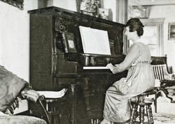 Edith Raymond Cochrane playing the piano at 245 Keokuk Street, Petaluma, California, about 1922