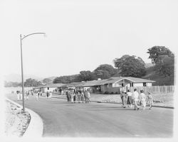 Prospective home buyers walk along Monte Verde Drive to view Saint Francis Acres model homes, Santa Rosa, California, 1958