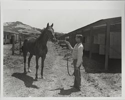 Unidentified horse and his groom posing at the Fairgrounds, Santa Rosa