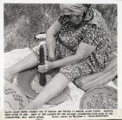 Elsie Allen pounding acorns into flour