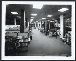 Looking at the fiction, art, and music sections of the Library, Santa Rosa, California, 1967