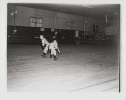 Two skaters in dog costumes in the Skating Revue of 1957, Santa Rosa, California, April, 1957