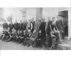 Men outside Waugh School on election day