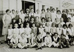 Mrs. Stewart with her third grade class, posing in front of Lincoln Primary School, Petaluma, Calif, 1931