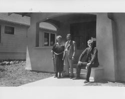 E. W. M. and Martha Evans in front of their newly constructed home at 622 F Street, Petaluma, California, with an unidentified man, about 1926